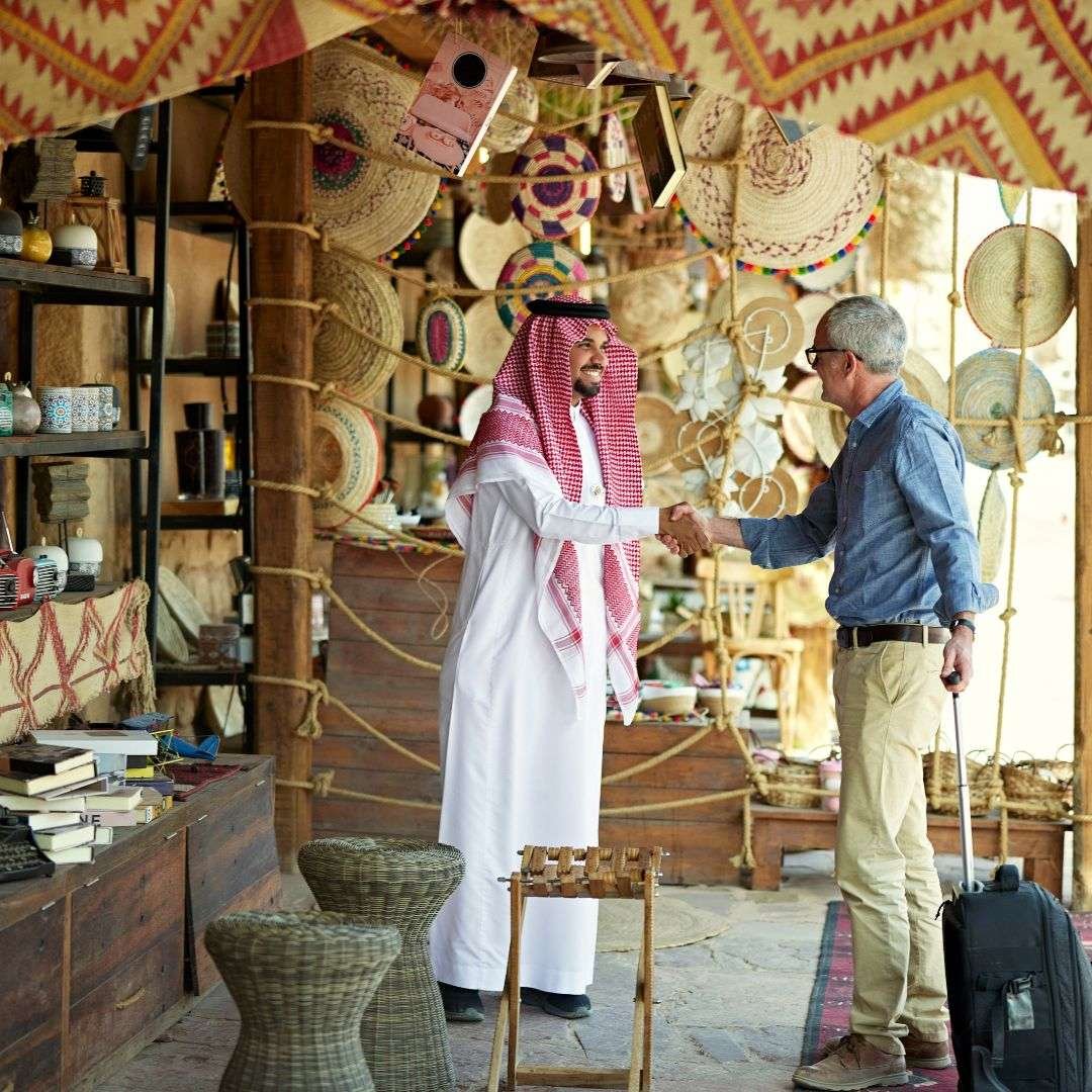 Businessman connecting with local merchant in Saudi Arabia