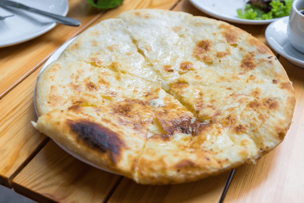 Khachapuri Megruli, Yeast bread baked in the oven with Georgian cheese.