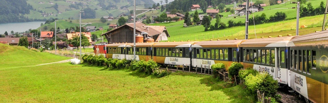 GoldenPass Express train travelling through the Swiss Alps